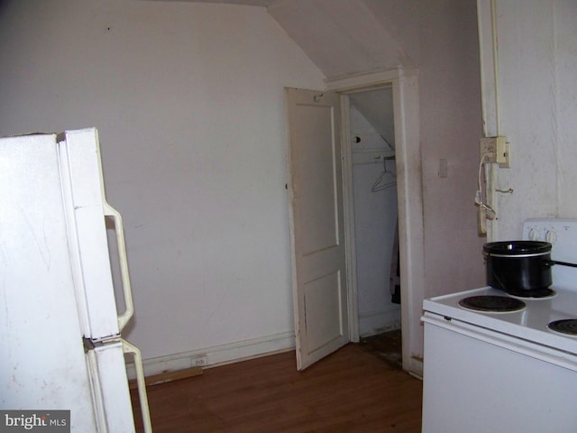 kitchen featuring wood-type flooring, white appliances, and lofted ceiling