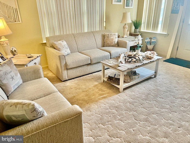 living room with light colored carpet and baseboards