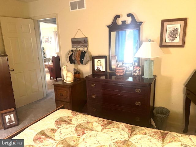 carpeted bedroom with a closet