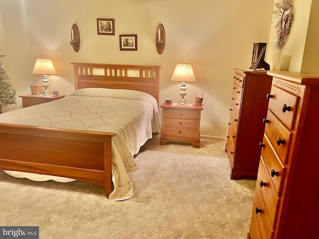 bedroom featuring light carpet