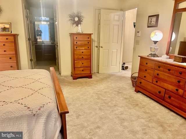 bedroom featuring light colored carpet