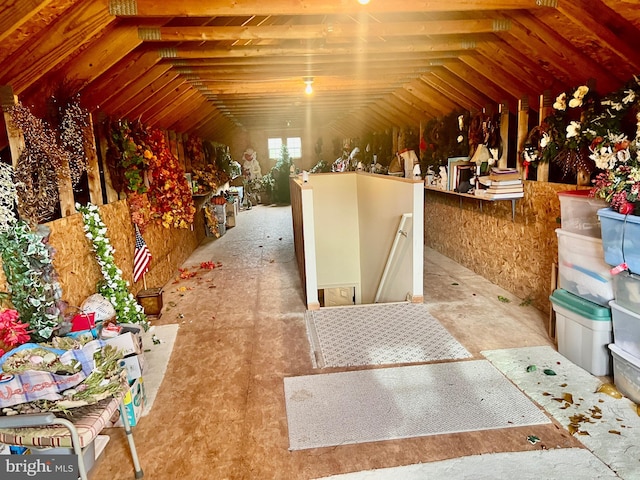 attic featuring an upstairs landing