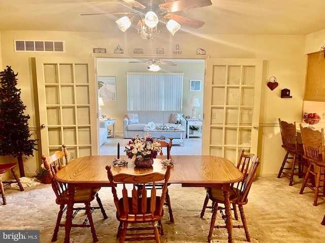 dining room featuring ceiling fan and carpet floors