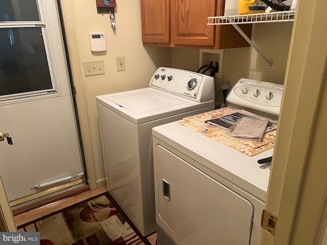 laundry area with cabinets and washer and dryer