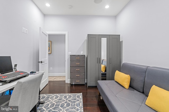 office space with dark hardwood / wood-style flooring