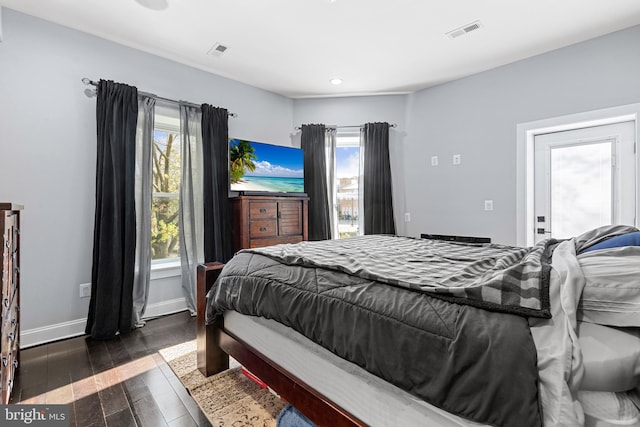 bedroom featuring dark hardwood / wood-style flooring