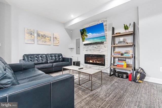 living room with built in shelves and a stone fireplace