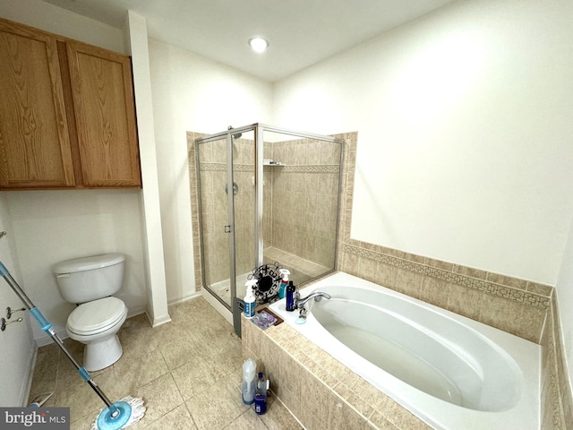 bathroom with tile patterned flooring, toilet, and shower with separate bathtub