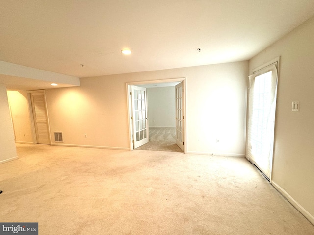 spare room with light colored carpet