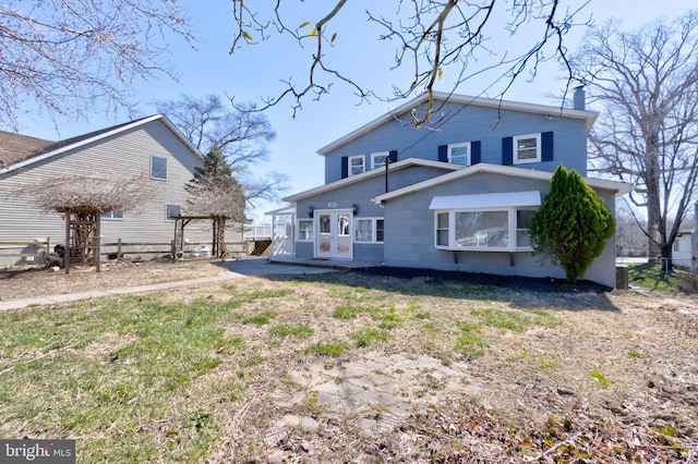 back of property featuring french doors