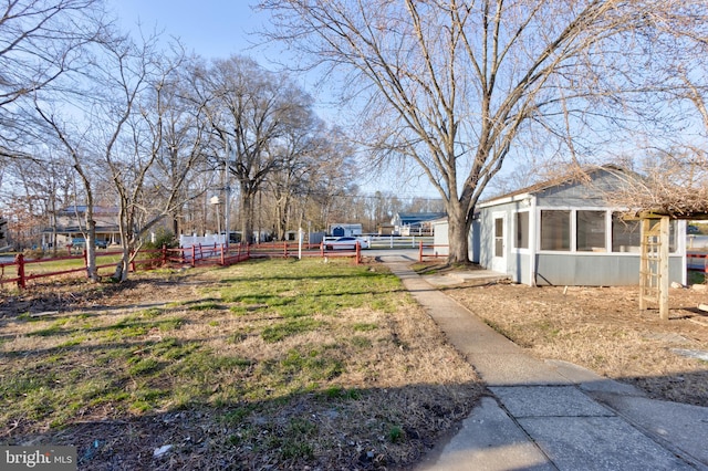 view of yard featuring a sunroom