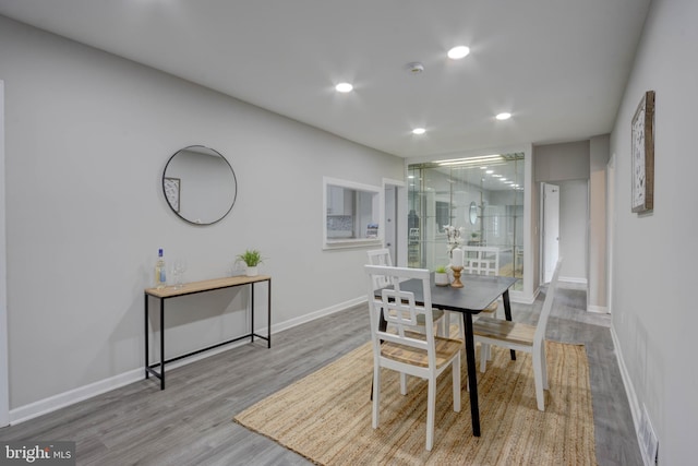 dining space featuring light wood-type flooring