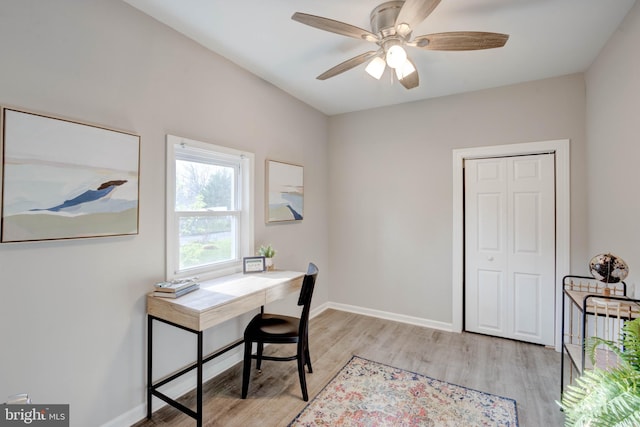 office space with light wood-type flooring and ceiling fan