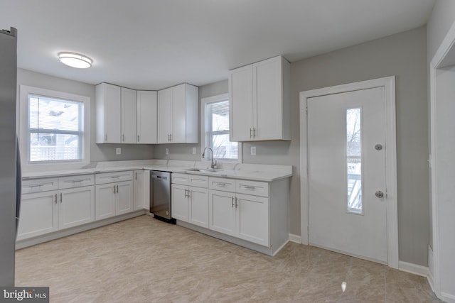 kitchen with dishwasher, white cabinetry, and a healthy amount of sunlight