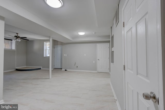 basement with ceiling fan