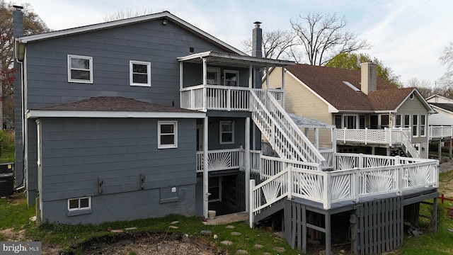 back of property featuring a deck