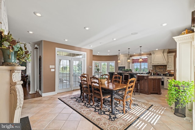 dining room featuring french doors and light tile flooring