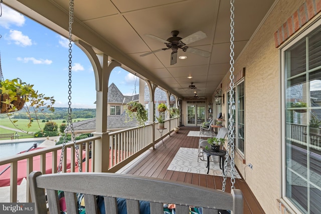 wooden terrace with ceiling fan