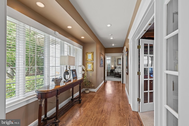 hall with light hardwood / wood-style floors