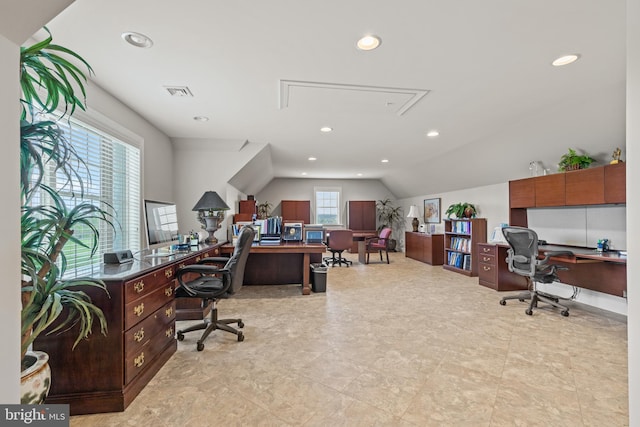 office space featuring light tile floors and lofted ceiling