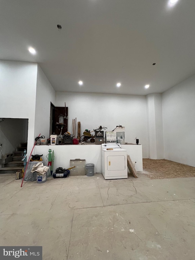 clothes washing area with washer / dryer