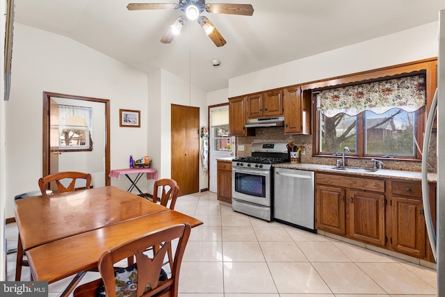 kitchen with backsplash, gas stove, ceiling fan, dishwasher, and sink