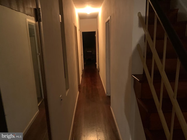 hall with dark hardwood / wood-style floors