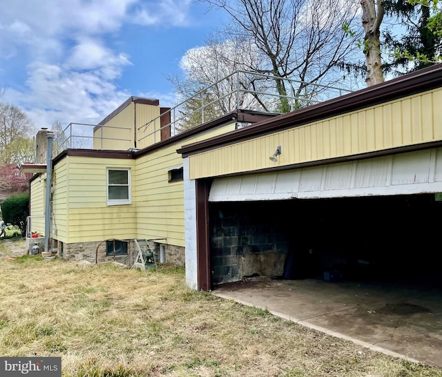 view of side of home with a garage