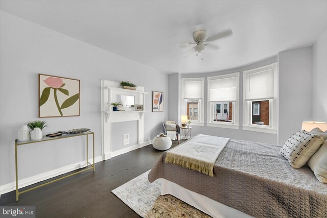 bedroom featuring ceiling fan and dark wood-type flooring