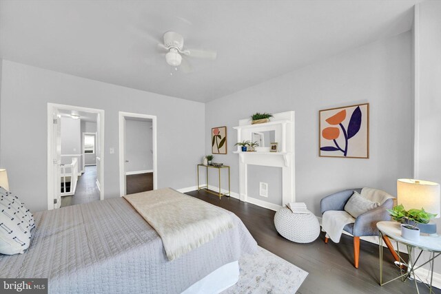 bedroom with ceiling fan and dark hardwood / wood-style floors