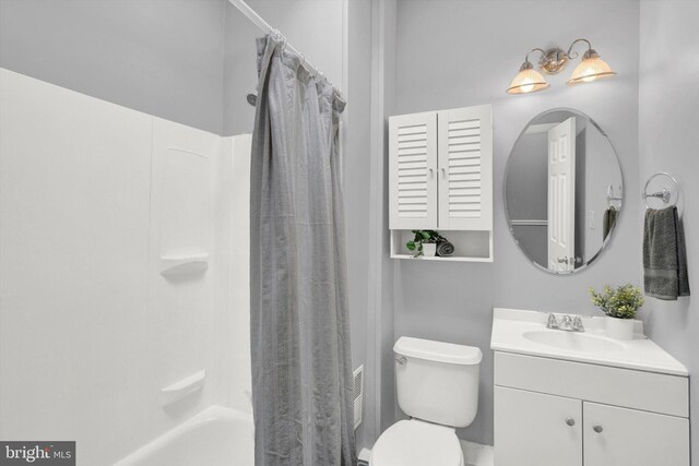 full bathroom with oversized vanity, shower / tub combo, and toilet