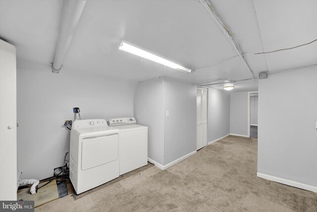 laundry area featuring light colored carpet, hookup for a washing machine, and washer and dryer