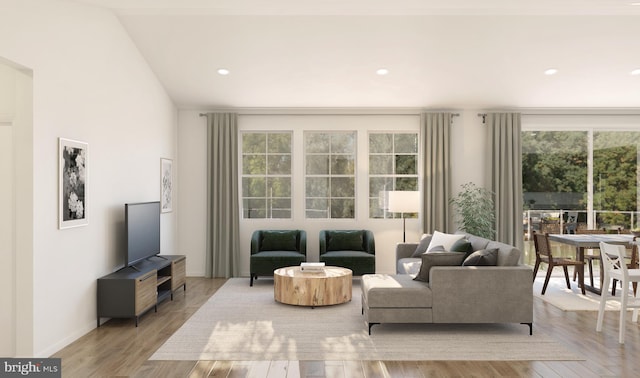 living area with baseboards, wood finished floors, and recessed lighting