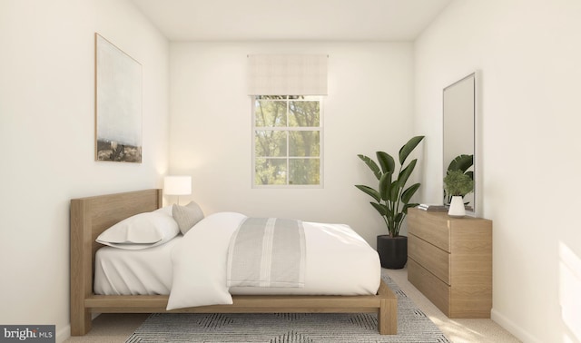 carpeted bedroom featuring baseboards