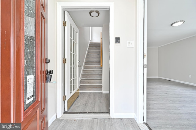 entryway with light hardwood / wood-style flooring