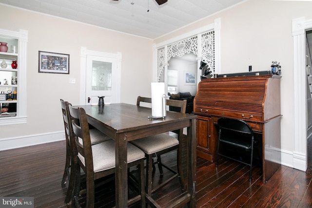 dining area featuring ceiling fan, dark wood-type flooring, and ornamental molding