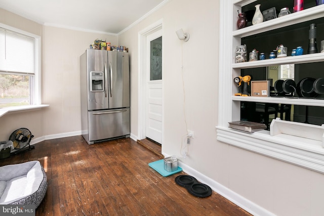 kitchen with ornamental molding, stainless steel fridge with ice dispenser, and dark hardwood / wood-style flooring