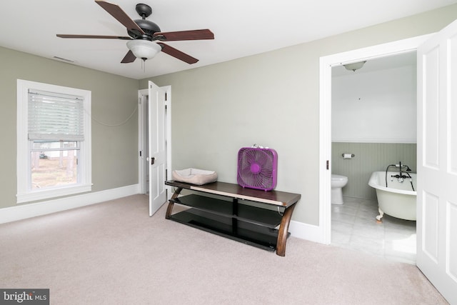 miscellaneous room with light colored carpet and ceiling fan