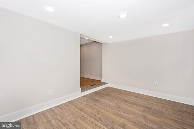 spare room featuring hardwood / wood-style flooring