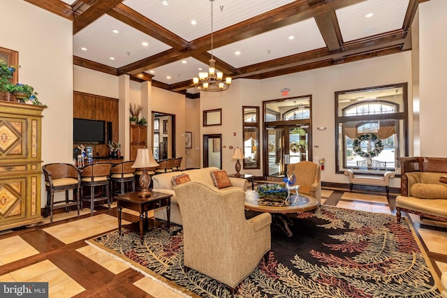 tiled living room featuring coffered ceiling, a notable chandelier, beam ceiling, and a high ceiling