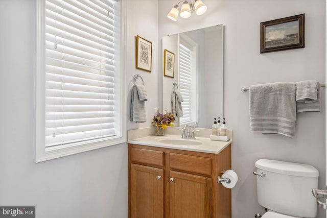 bathroom with vanity and toilet