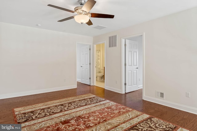 unfurnished room featuring dark hardwood / wood-style flooring and ceiling fan