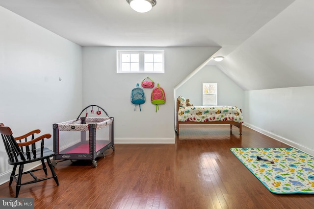 rec room with dark hardwood / wood-style flooring and vaulted ceiling