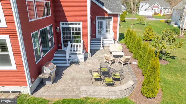 entrance to property with a patio