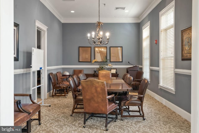 dining area with a notable chandelier, crown molding, and light carpet