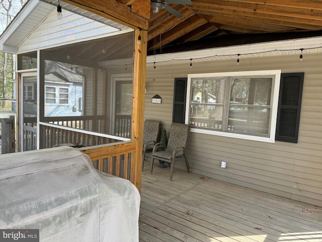 wooden deck featuring a sunroom