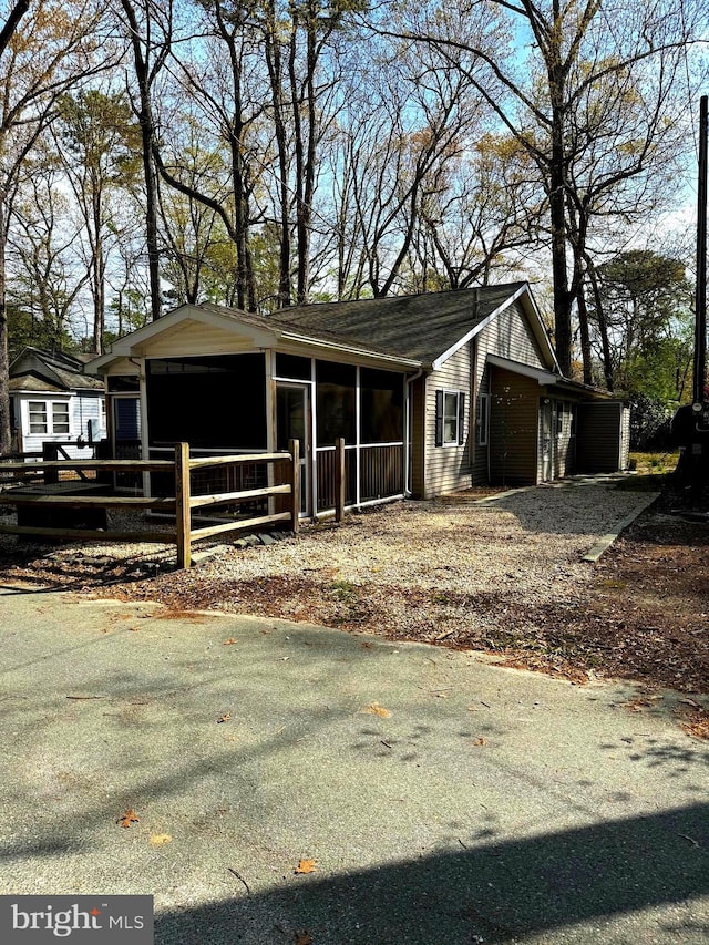 view of front facade with a wooden deck