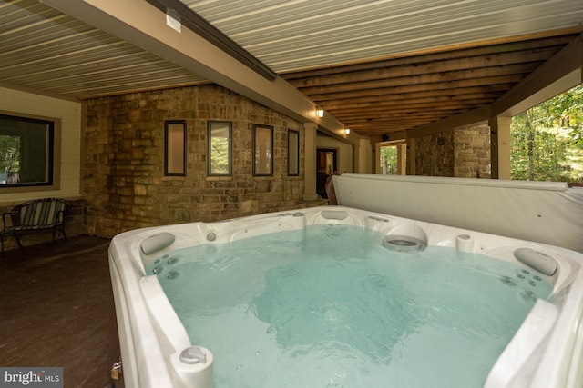 view of pool featuring a hot tub