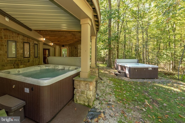 view of terrace featuring a hot tub