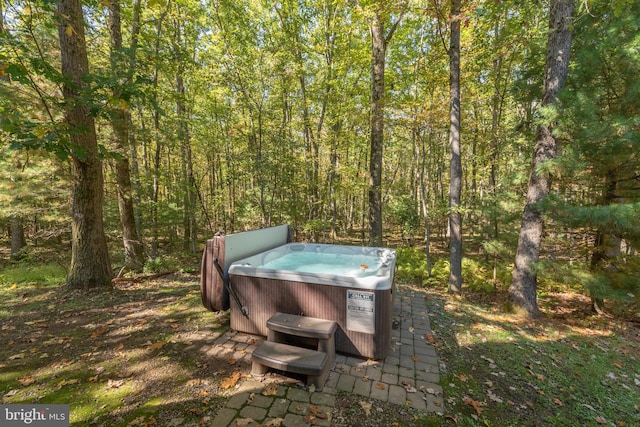 exterior space with a hot tub